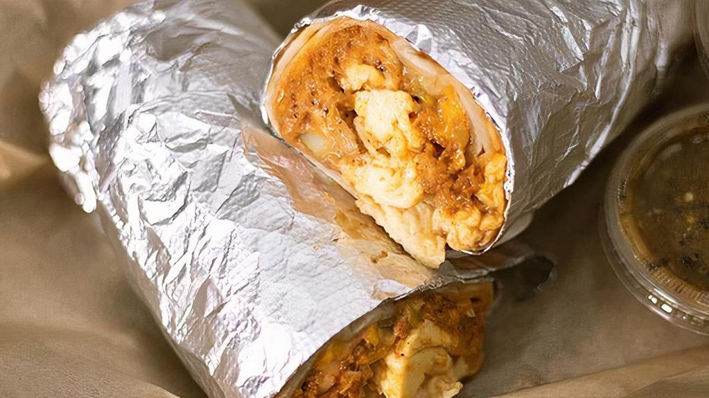 Breakfast Burrito · Cage-free eggs, refried pinto beans, potatoes, chorizo, Green Chile Queso and shredded mixed cheese with roja salsa and tomatillo sauce, wrapped in a flour tortilla.