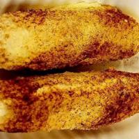 Corn Sticks · Corn on a cob with your choice of topping: classic butter, cheesy, or cheesy spicy.