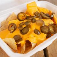 Cheesy Nachos · Classic styled nachos with cheese and jalapeños.