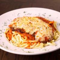 Chicken Parmigiana · Breaded chicken breast baked with marinara sauce & mozzarella cheese on top.