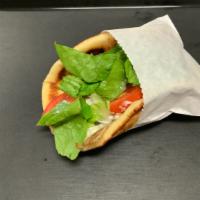 #2. Chicken Gyro Pita · Sliced, seasoned chicken served on pita bread with lettuce, onions, tomatoes and tzatziki sa...