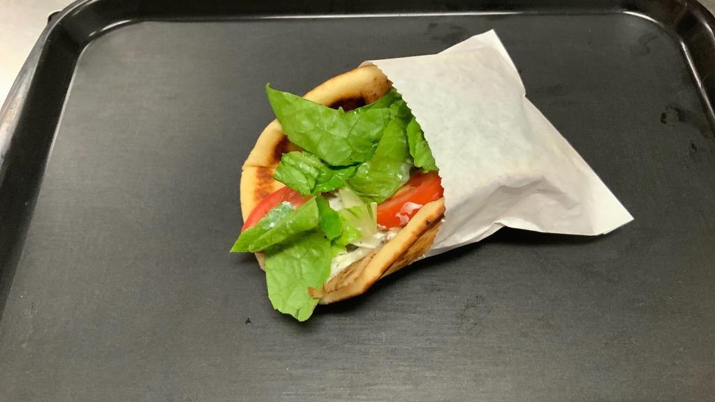 #2. Chicken Gyro Pita · Sliced, seasoned chicken served on pita bread with lettuce, onions, tomatoes and tzatziki sauce.