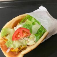 #3. Chicken Shawarma Pita · Sliced, marinated chicken served on pita with lettuce, onions, tomatoes and tzatziki sauce.