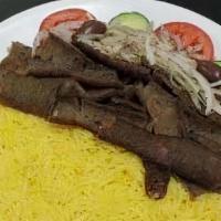 #17. Gyro Plate · Sliced, seasoned gyro meat served with rice, seasoned onion, tomato, cucumber, pita and tzat...