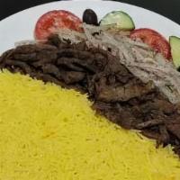 #22. Beef Shawarma · Sliced, marinated tender beef served with rice, seasoned onion, tomato, cucumber, pita and t...