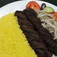 #25. Kifta Plate · Grilled ground beef served with rice, seasoned onion, tomato, cucumber, pita and tzatziki sa...