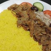 #18. Chicken Gyro Plate · Sliced, seasoned chicken served with rice, seasoned onion, tomato, cucumber, pita and tzatzi...