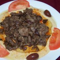 #29. Hummus Shawarma · Blended chick peas, tahini, garlic, lemon juice served with shawarma, tomatoes, olives and p...