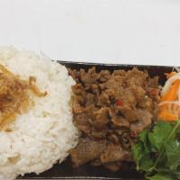 Beef Rice Bowl · Sweet sour beef on white rice with pickle papaya and carrot, cilantro. Add extra meat for an...