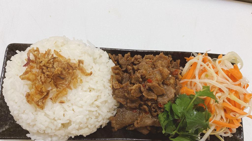 Beef Rice Bowl · Sweet sour beef on white rice with pickle papaya and carrot, cilantro. Add extra meat for an additional charge.