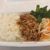 Pork Rice Bowl · Sliced pork on white rice with pickle papaya and carrot, cilantro. Add extra meat for an add...