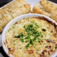 Salmon & Artichoke Dip · Wild caught salmon, marinated artichoke hearts and a blend of cheeses served with warm crost...