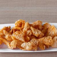 Cajun Pork Chicharrón · Cooked from scratch, fried pork cracklings tossed in our house blend of Cajun spices.