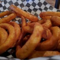 Onion Rings · Big basket of onion rings lightly breaded in panko breadcrumbs and fried to a golden brown. ...