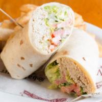 Turkey Bacon Avocado Wrap · Turkey, bacon, avocado, tomatoes, lettuce, jack cheese and ranch all in a warm flour tortill...