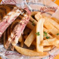 The Reuben · Corned beef thinly sliced and piled high topped with Swiss cheese, sauerkraut and 1000 islan...
