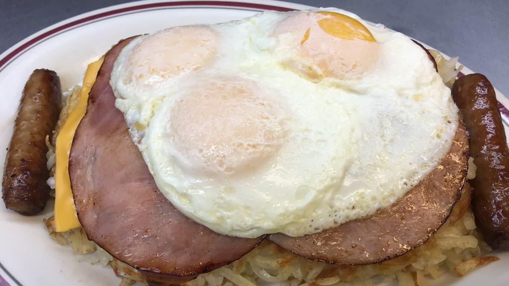 Olympian Breakfast · Special. A local favorite! Hash browns topped with layers of swiss and American cheese, two slices of ham, three eggs (any style). Includes choice of bacon or sausage and toast or pancakes or French toast.