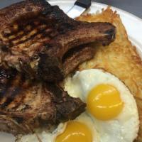 Pork Chops & Eggs · Two pork chops and two eggs served with hash browns and toast or pancakes or French toast.