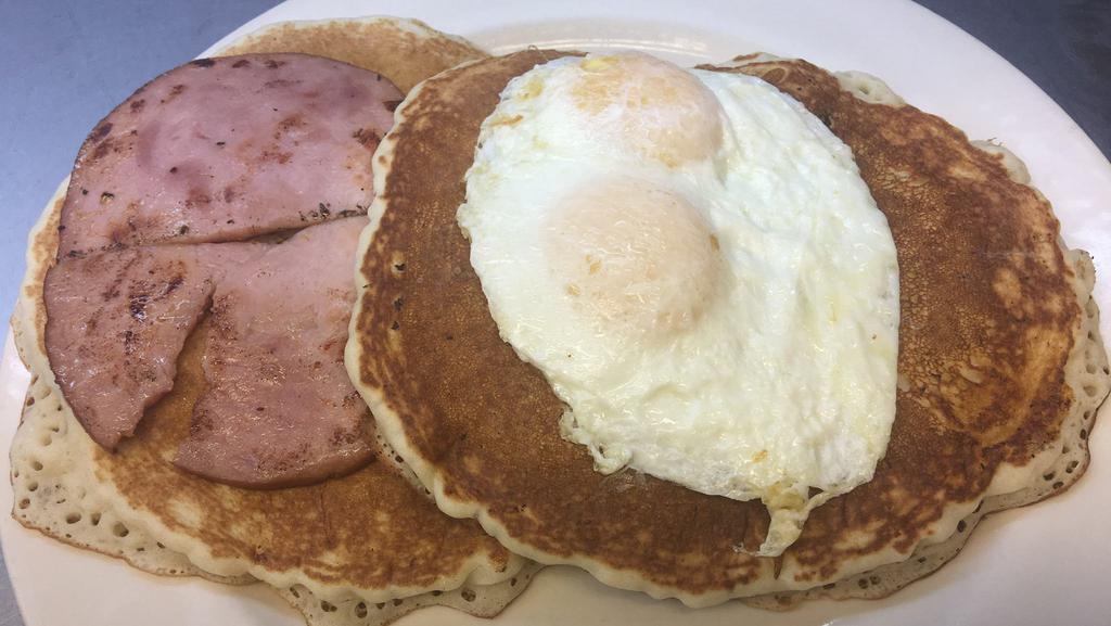 Pancake Sandwich · Two large pancakes served with ham and topped with two large eggs.