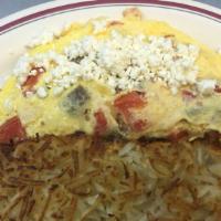 Greek Omelet · Special. Omelet filled with feta cheese, tomatoes, onions, and choice of bacon or gyro meat.