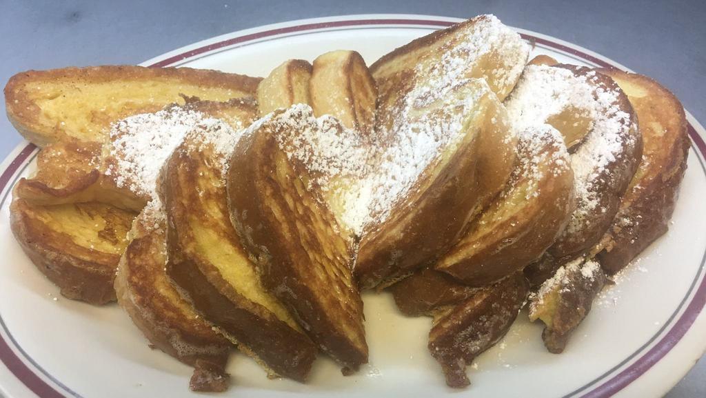 French Toast Combo · Two large French toast, two links of sausage and two strips of bacon.