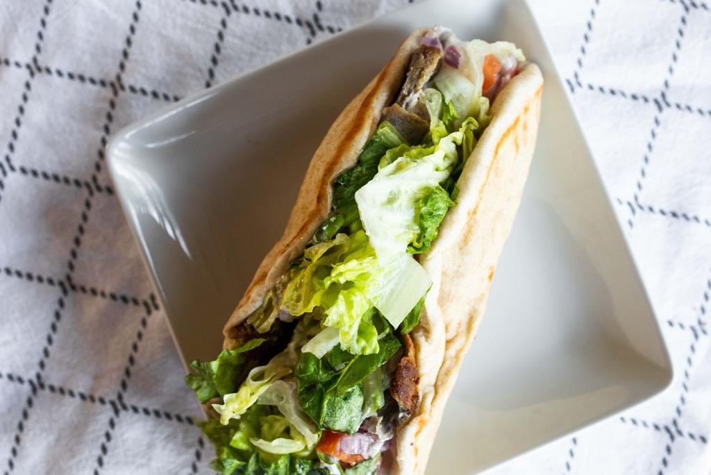 Gyro Sandwich · Lamb, chicken or beefteki served in pita bread with lettuce, tomato, onions, and cucumber sauce.
