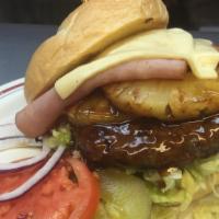 The Hawaiian · 1/2 lb. ground beef patty, topped with two slices ham, swiss cheese, pineapple and teriyaki ...