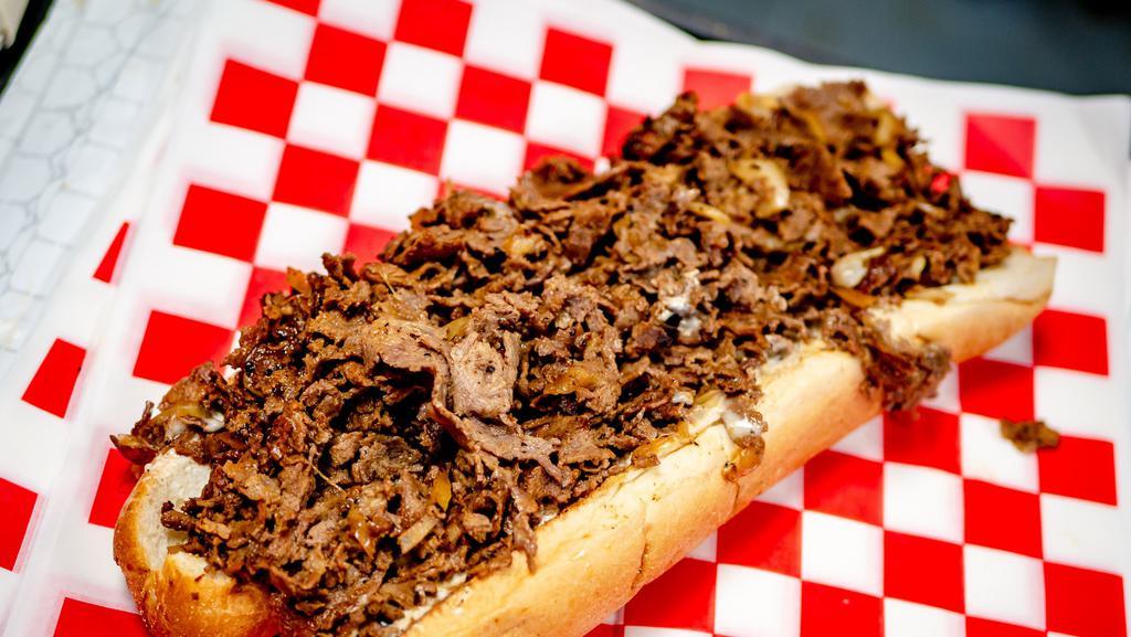 Cheese Steak · Philadelphia's favorite, served with juicy seasoned steak, melted cheese and onions.
