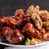 50 Wings · Bone in wings tossed with flavors of your choice.  Garlic,  Lemon Pepper,   Honey BBQ,  STL ...