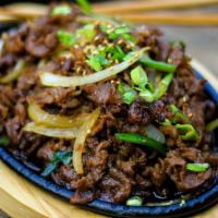 Beef Bulgogi · Specially marinated beef rib-eye served over onion.