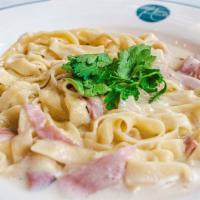 Frankie'S Linguine · House-rolled pasta ribbons tossed in creamy béchamel with country ham and gruyere