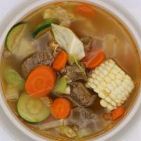 Caldo De Res · Beef soup served with cilantro, diced onions, limes and Mexican rice on the side.