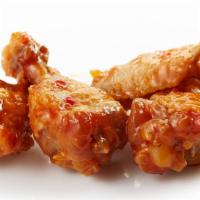 The Honey Red Wings · Exotic honey-red sauce topped on batch of oven-baked chicken wings.