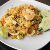 Phayathai Fried Rice · Egg, carrot, pea, raisin, yellow curry powder, cashew nut onion, shrimp & chicken and pineap...