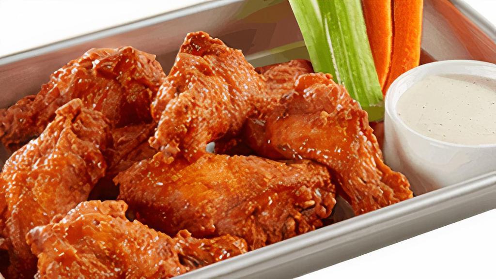 Traditional Wings · Choice of Buffalo Mild, Buffalo Hot, BBQ, Honey Hot, and Mango Habanero Sauces. Served with carrots, celery and Ranch Dressing.