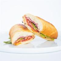 Sicilian Sandwich · Herbed cream cheese, pepperoni, salami, red onions, and Roma tomatoes.