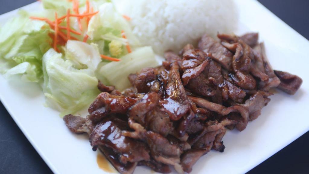 Pork Teriyaki · Served with salad and steamed rice.