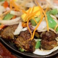 Durbar Mixed Grill · A delicious combination of lamb, chicken, and seafood grilled in tandoor.