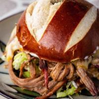 Brisket Sandwich · Texas style slow smoked Brisket with our House made Rub, Smoked Gouda cheese, Mayo, and
lett...