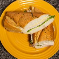 2 Timing Turkey · Honey turkey, swiss, honey mustard dressing, and lettuce on a french roll