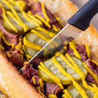 A.P.D. (Grilled) · Pastrami, pickles, and yellow mustard on a French roll