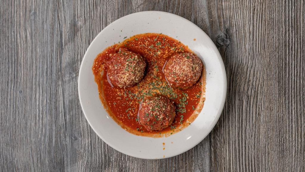 Manhattan Meatballs · Three delicious meatballs in marinara sauce.