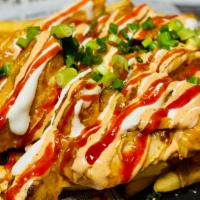 Tikka Fries · Two Handed Breaded Chicken Tenders| Green Chile Queso Garlic Cream| Tikka Sauce Sriracha|Cil...