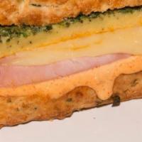 Ham And Cheese On Cheddar Chive Scone · Homemade scone, ham, swiss cheese, egg frittata and aioli.
