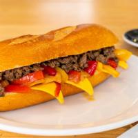 Philly Cheesesteak Sandwich · Thinly sliced spiced beef with sauteed onions and peppers topped with melted American cheese...