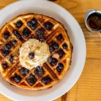 Cobbler Waffle · Belgian waffle with blueberries, streusel and whipped cream. Served with maple syrup and hom...