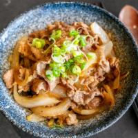 Gyu Don 牛丼 · USDA prime beef slices and onion over rice with shiso garlic soy sauce.