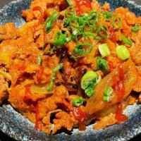 Jeyuk Bokkeum(Korean Spicy Pork Rice) · thin slices of pork are marinated in spicy sauce and then stir-fried quickly over rice.
