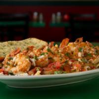 El Diablo Pasta · You won’t need a fire hose but this dish definitely has a kick! We toss chicken or BIG tail-...