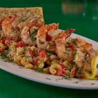 Lady Is A Scampi · We take chicken or BIG tail-on shrimp and mix it with spiral pasta, diced tomatoes, fresh ci...